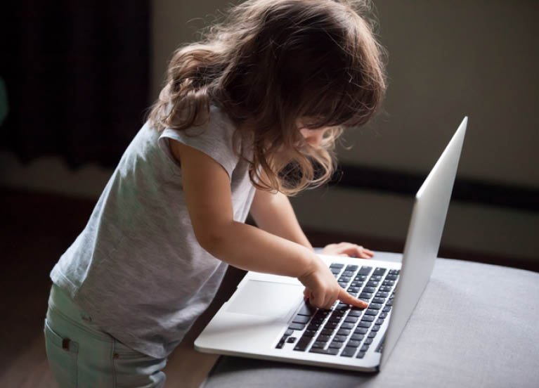 Image of a child on a device