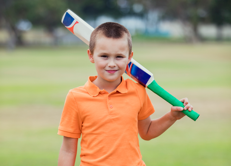 Image of child playing cricket