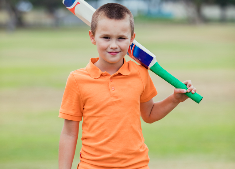 Junior cricket, child holding a cricket bat