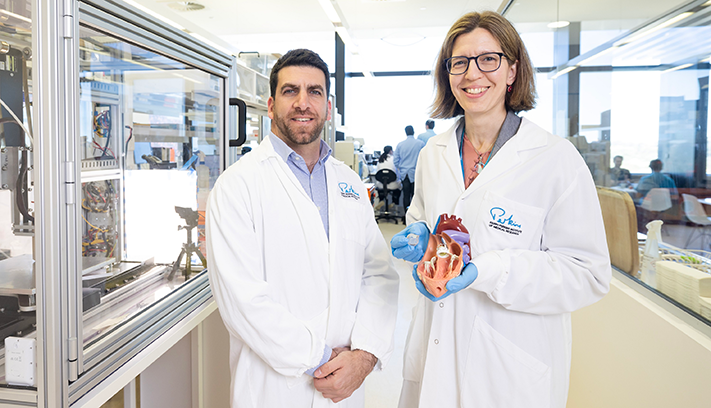 A pair of researchers standing together.