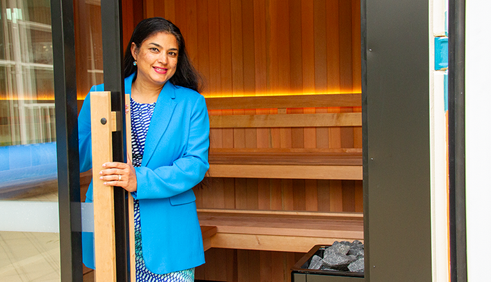 Cr Andrea Creado at the new outdoor sauna.