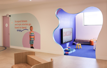 A waiting room with playroom visible.