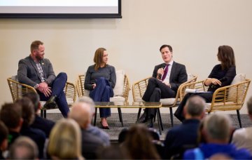 A group of WA sporting leaders speak at a function.