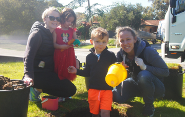 Family with their new street tree.