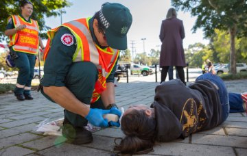 A paramedic treats a 'casualty'.