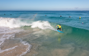 Family surfing lessons at Perth's Scarborough beach – fun and safe coastal activity for all ages, perfect for learning to surf together at Scarborough