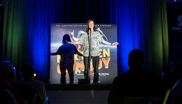 A comedian performs on stage at Next Gen Comedy.
