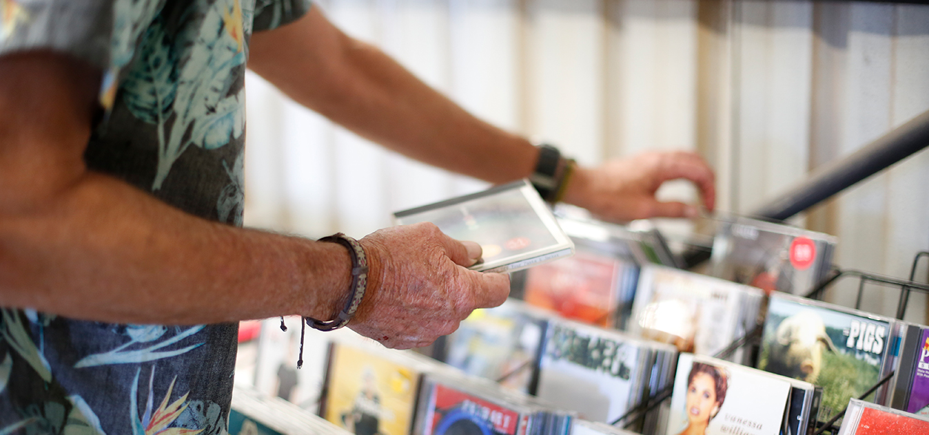 A Recycling Shop customer browses through some previously loved CD's